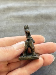 Five Chinese bronze seals and an Indonesian bronze figure group, 18/19th C.
