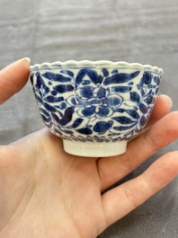 A set of six Chinese blue and white cups and saucers with floral design, Kangxi