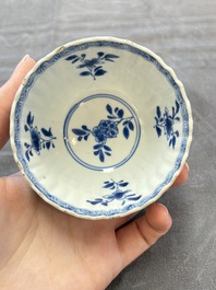 A set of six Chinese blue and white cups and saucers with floral design, Kangxi