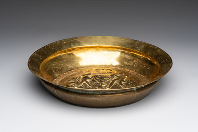 A German brass repouss&eacute; 'the Grapes of Canaan' dish, Nuremberg, 17th C.