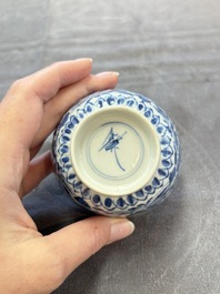 A set of six Chinese blue and white cups and saucers with floral design, Kangxi