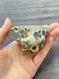 Two Chinese gilt-decorated famille rose cups and saucers with floral design, Qianlong