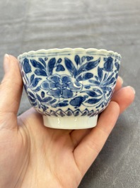 A set of six Chinese blue and white cups and saucers with floral design, Kangxi