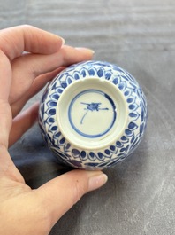 A set of six Chinese blue and white cups and saucers with floral design, Kangxi