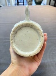 A Chinese famille rose 'mandarin subject' jug and cover, Qianlong
