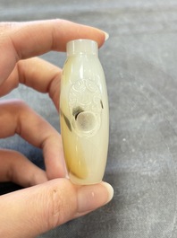 A collection of nine Chinese agate snuff bottles, 20th C.