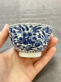 A set of six Chinese blue and white cups and saucers with floral design, Kangxi