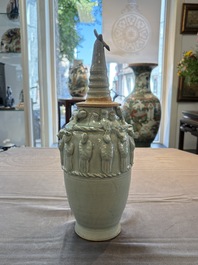 A Chinese qingbai-glazed covered urn applied with zodiac figures, Song