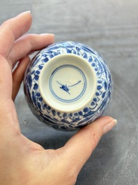A set of six Chinese blue and white cups and saucers with floral design, Kangxi