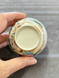 A pair of Chinese famille rose 'European subject' cups and saucers, Qianlong