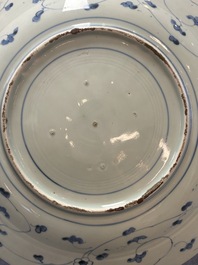 Three Japanese blue and white flower-shaped plates and a 'fisherman' dish, Edo, 17/18th C.