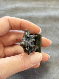 Five Chinese bronze seals and an Indonesian bronze figure group, 18/19th C.