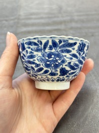 A set of six Chinese blue and white cups and saucers with floral design, Kangxi