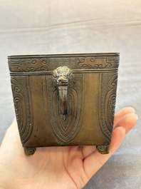 A Chinese archaistic bronze square censer with two handles, Xuande mark, Qing