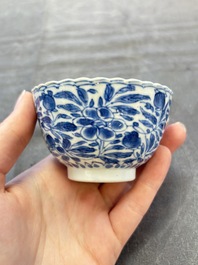 A set of six Chinese blue and white cups and saucers with floral design, Kangxi