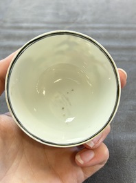 A pair of Chinese famille rose 'European subject' cups and saucers, Qianlong