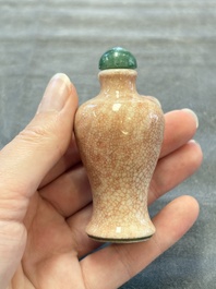 A Chinese peachbloom-crackle-glazed 'meiping' snuff bottle and a figural blue, white and copper-red snuff bottle, Yongzheng mark, 19th C.