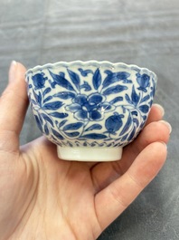 A set of six Chinese blue and white cups and saucers with floral design, Kangxi