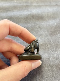 Five Chinese bronze seals and an Indonesian bronze figure group, 18/19th C.