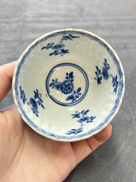 A set of six Chinese blue and white cups and saucers with floral design, Kangxi
