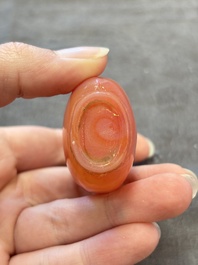 A collection of nine Chinese agate snuff bottles, 20th C.