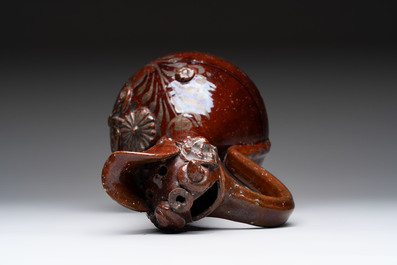 An Ottoman Canakkale pottery ewer with applied floral rosettes, Turkey, 19th C