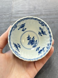 A set of six Chinese blue and white cups and saucers with floral design, Kangxi