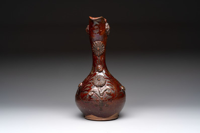 An Ottoman Canakkale pottery ewer with applied floral rosettes, Turkey, 19th C