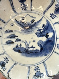 A Chinese blue and white ko-sometsuke flower-shaped tripod 'landscape' plate for the Japanese market, late Ming