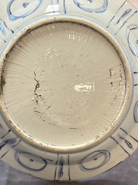 Three Chinese blue and white 'kraak' dishes with a bird and flowers, Wanli
