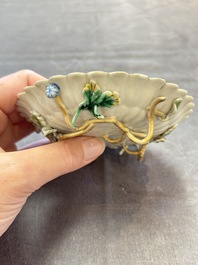 Two Chinese gilt-decorated famille rose cups and saucers with floral design, Qianlong