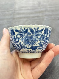 A set of six Chinese blue and white cups and saucers with floral design, Kangxi