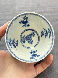 A set of six Chinese blue and white cups and saucers with floral design, Kangxi