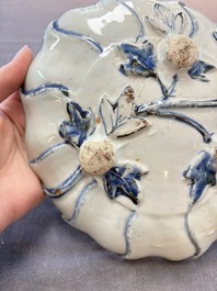 A Chinese blue and white ko-sometsuke flower-shaped tripod 'landscape' plate for the Japanese market, late Ming