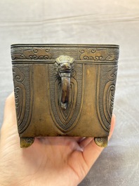 A Chinese archaistic bronze square censer with two handles, Xuande mark, Qing