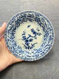 A set of six Chinese blue and white cups and saucers with floral design, Kangxi