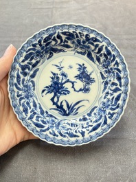 A set of six Chinese blue and white cups and saucers with floral design, Kangxi