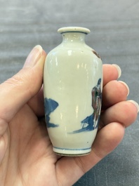 A Chinese peachbloom-crackle-glazed 'meiping' snuff bottle and a figural blue, white and copper-red snuff bottle, Yongzheng mark, 19th C.