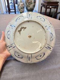 Three Chinese blue and white 'kraak' dishes with a bird and flowers, Wanli