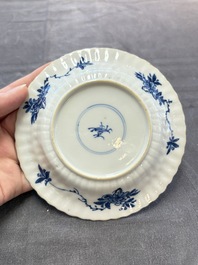 A set of six Chinese blue and white cups and saucers with floral design, Kangxi