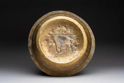 A German brass repouss&eacute; 'the Grapes of Canaan' dish, Nuremberg, 17th C.