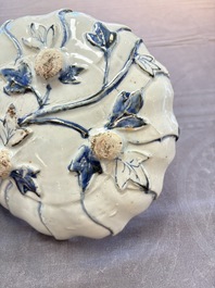 A Chinese blue and white ko-sometsuke flower-shaped tripod 'landscape' plate for the Japanese market, late Ming