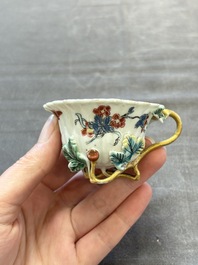 Two Chinese gilt-decorated famille rose cups and saucers with floral design, Qianlong