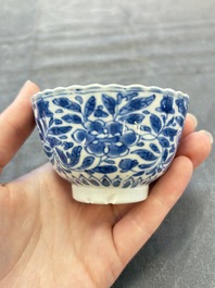 A set of six Chinese blue and white cups and saucers with floral design, Kangxi