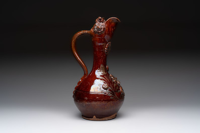 An Ottoman Canakkale pottery ewer with applied floral rosettes, Turkey, 19th C
