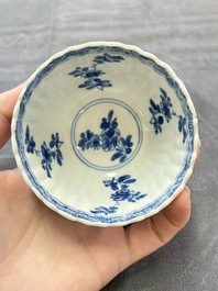 A set of six Chinese blue and white cups and saucers with floral design, Kangxi