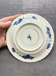 A set of six Chinese blue and white cups and saucers with floral design, Kangxi