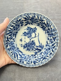 A set of six Chinese blue and white cups and saucers with floral design, Kangxi