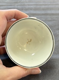A pair of Chinese famille rose 'European subject' cups and saucers, Qianlong