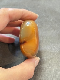 A collection of nine Chinese agate snuff bottles, 20th C.